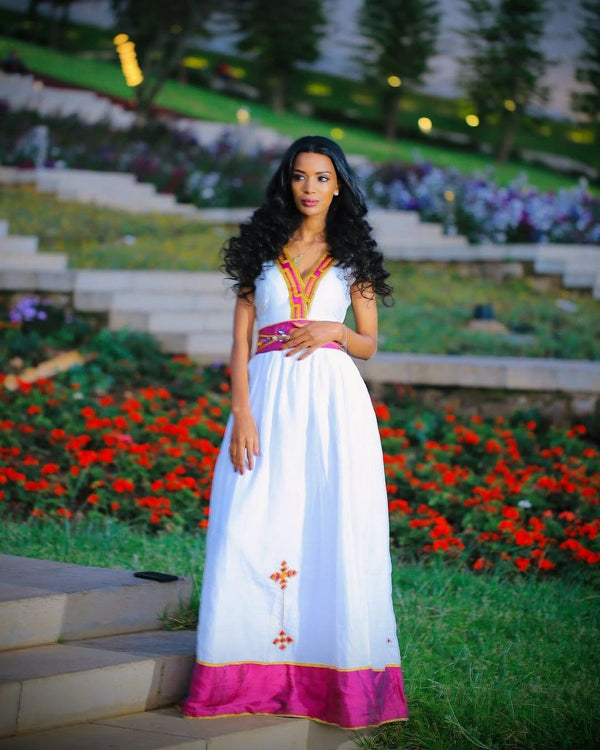 Simple Habesha Dress with Vibrant Pink and Gold Embroidery for Special Occasions