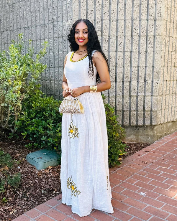 Simple Habesha Dress with Vibrant Yellow Embroidery a Choice for Everyday wear