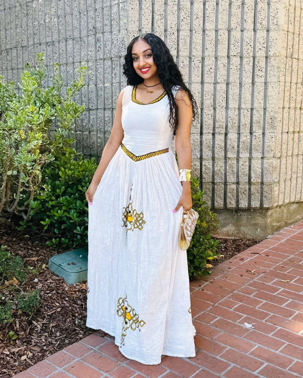 Simple Habesha Dress with Vibrant Yellow Embroidery a Choice for Everyday wear